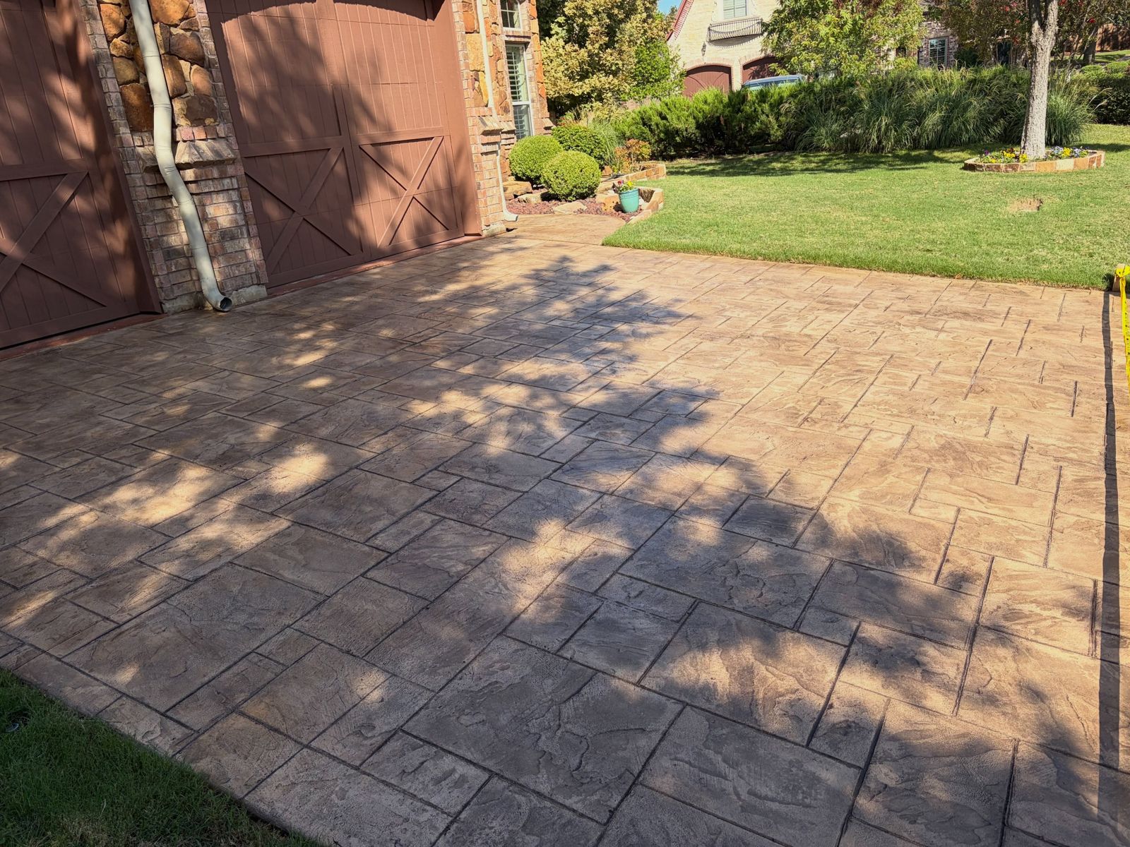 Stamped ashlar-pattern concrete in afternoon sun